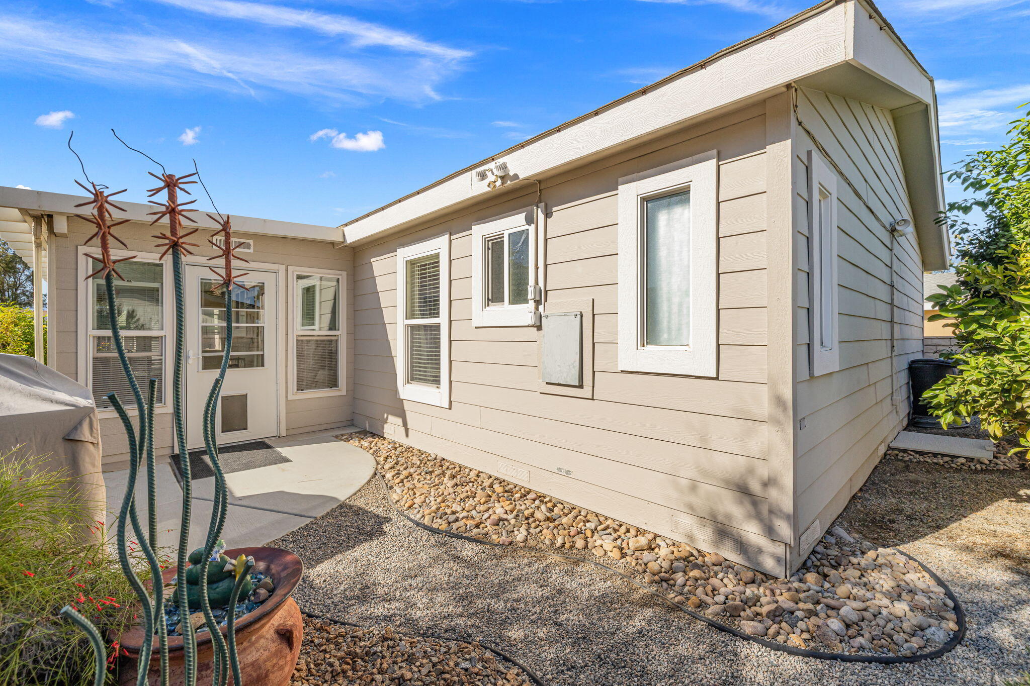 34960 Serenade Thousand Palms, CA 92276 - Photo 36 of 50 a front view of a house with a yard