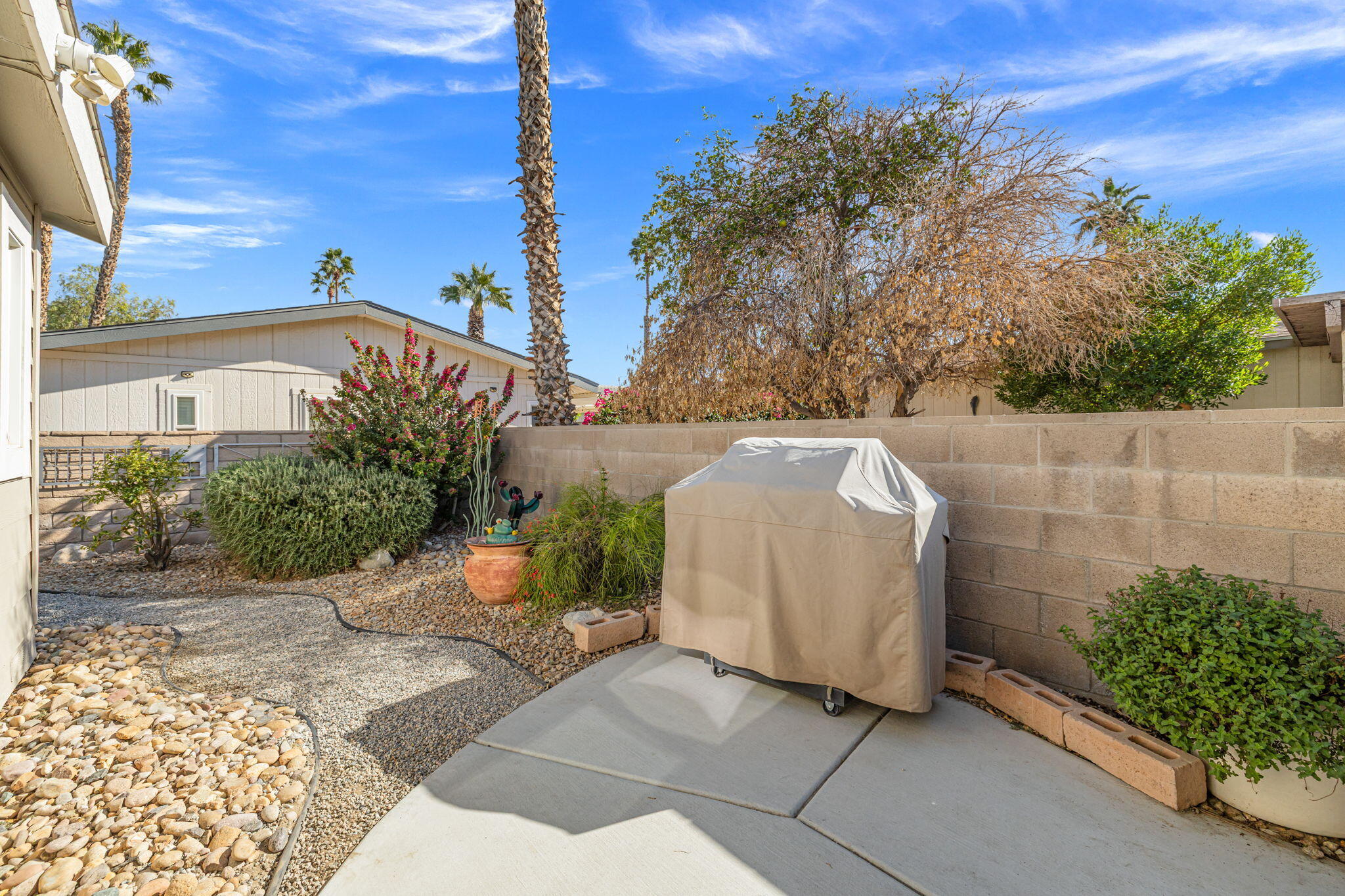 34960 Serenade Thousand Palms, CA 92276 - Photo 37 of 50 a view of a backyard with sitting area