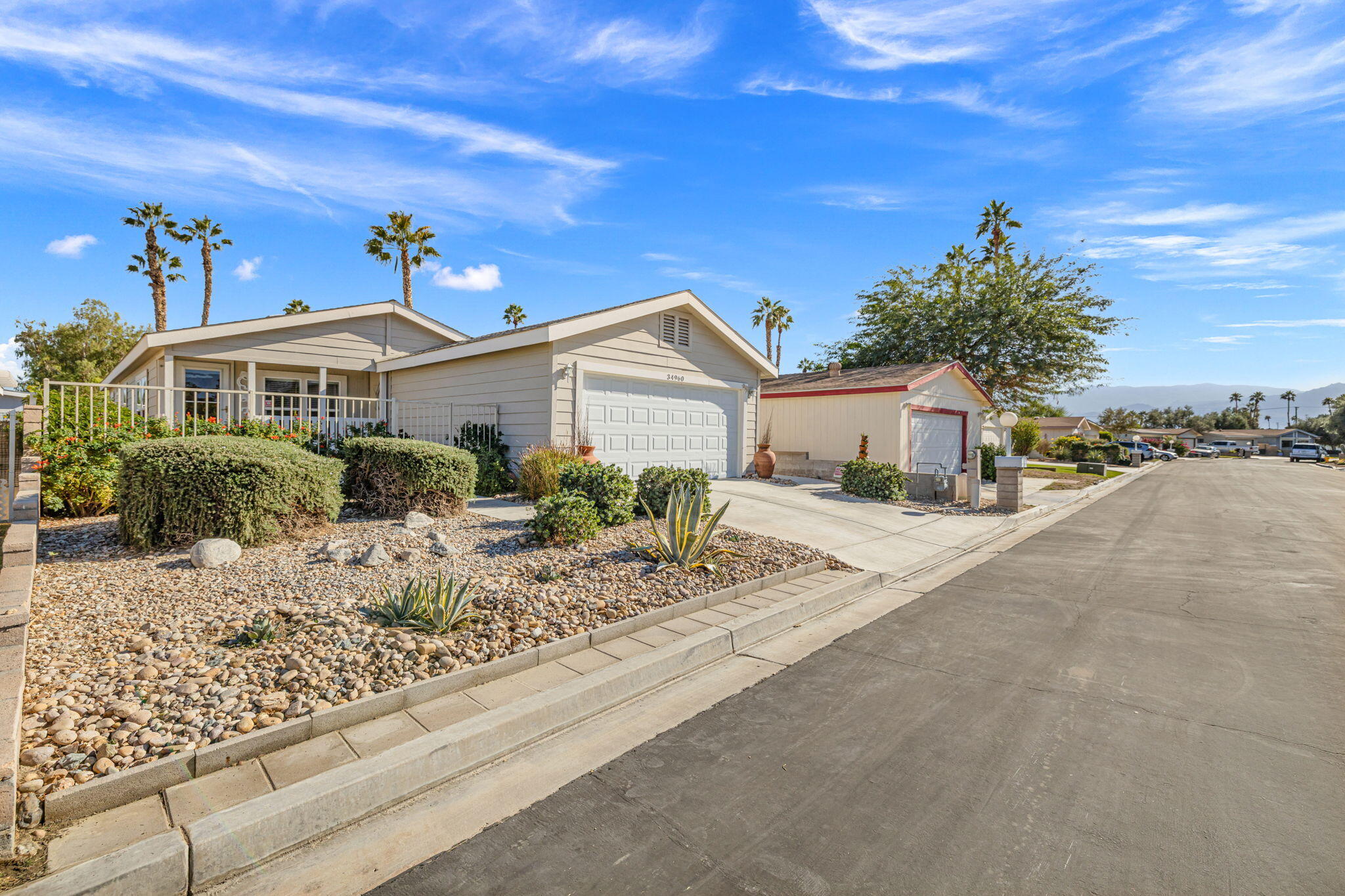 34960 Serenade Thousand Palms, CA 92276 - Photo 4 of 50 a front view of a house with garden