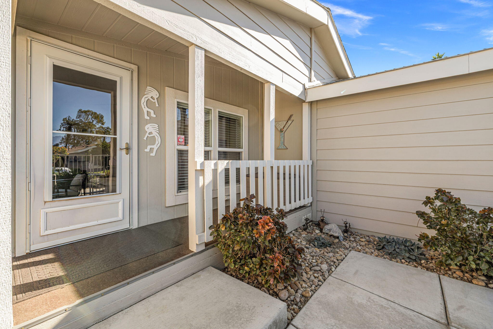 34960 Serenade Thousand Palms, CA 92276 - Photo 6 of 50 a view of a house with a small yard