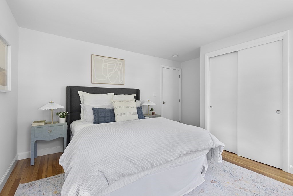 117 Oak Ridge Drive Ayer, MA 01432 - Photo 12 of 26 a bedroom with a bed and painting on the wall