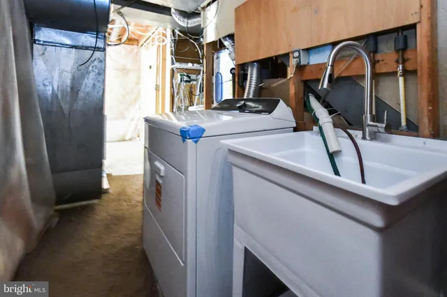 a utility room with dryer and washer