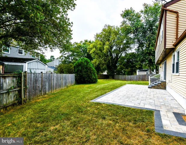 a view of backyard with green space
