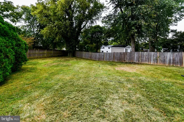 a swimming pool with wooden fence