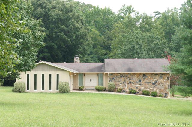 7930 Browne Road Charlotte, NC 28269 - Photo 1 of 1 a front view of a house with a garden