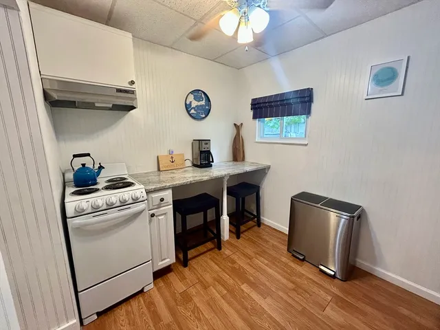 a view of workspace with wooden floor