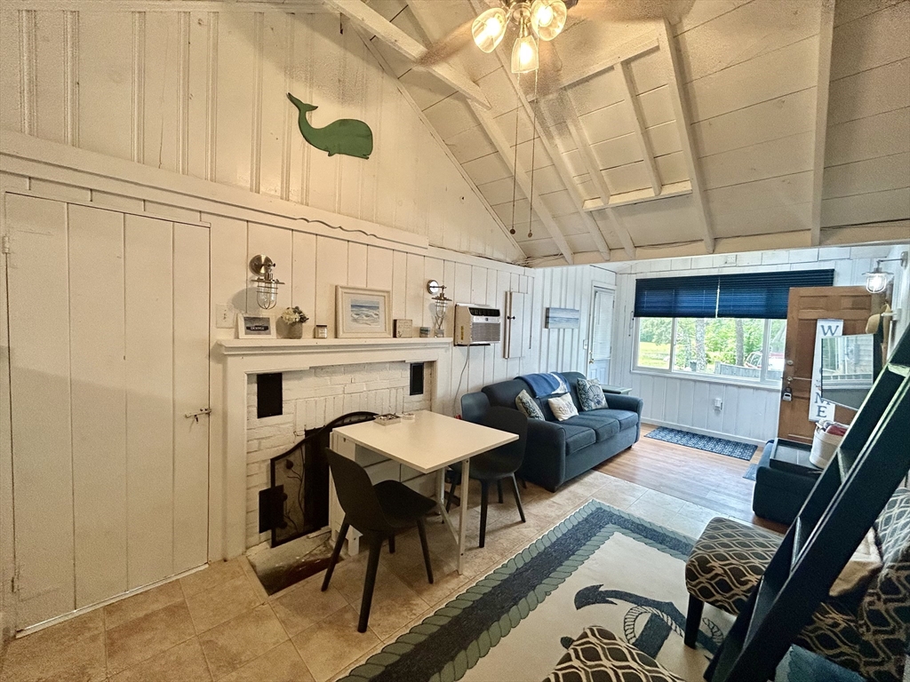 262 Old Wharf Road, Unit 67 Dennis, MA 02639 - Photo 18 of 36 a view of a dining room with furniture window and outside view
