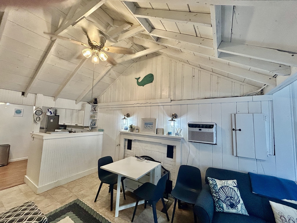 262 Old Wharf Road, Unit 67 Dennis, MA 02639 - Photo 19 of 36 a kitchen with cabinets and wooden floor