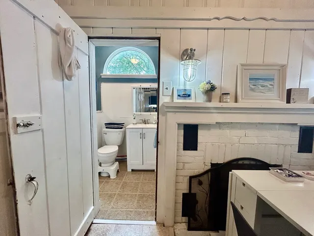 a bathroom with a sink a mirror and a toilet
