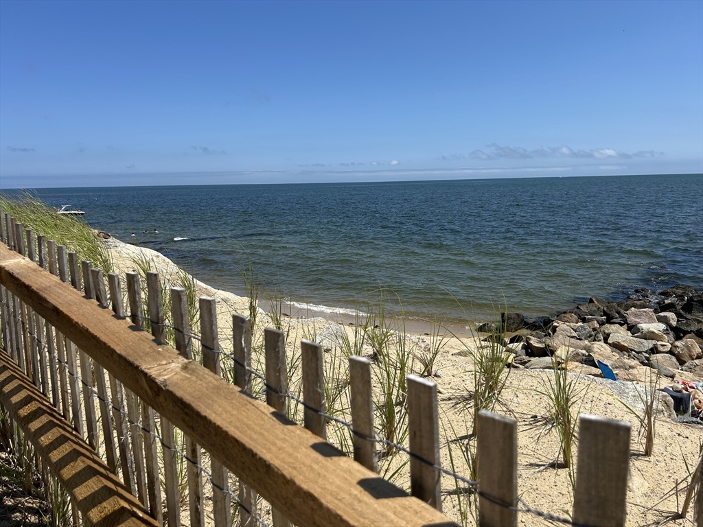 262 Old Wharf Road, Unit 67 Dennis, MA 02639 - Photo 2 of 36 a view of ocean from a balcony