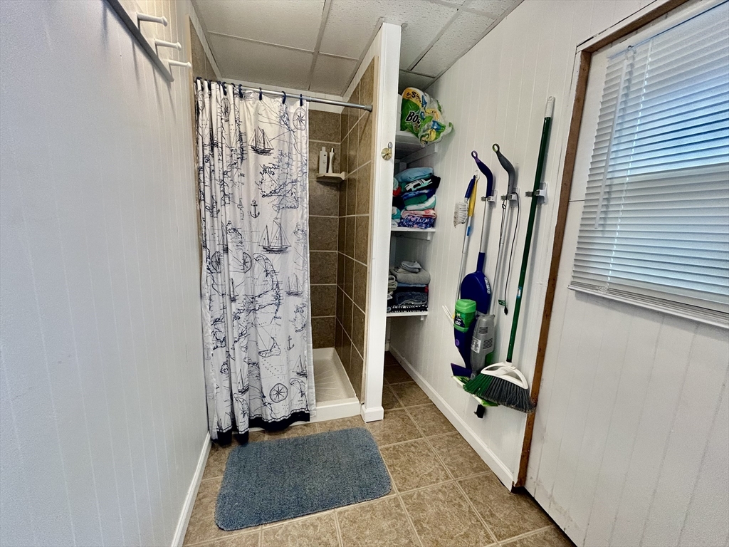 262 Old Wharf Road, Unit 67 Dennis, MA 02639 - Photo 21 of 36 a view of walk in closet with clothes and shoes