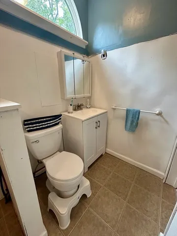 a bathroom with a toilet and a sink