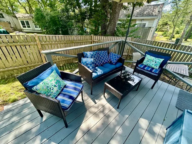 a view of a patio with wooden floor