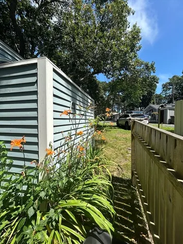 a view of balcony with wooden floor