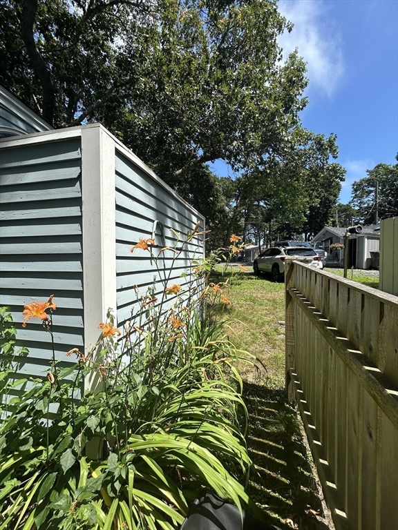 262 Old Wharf Road, Unit 67 Dennis, MA 02639 - Photo 28 of 36 a balcony view with a garden