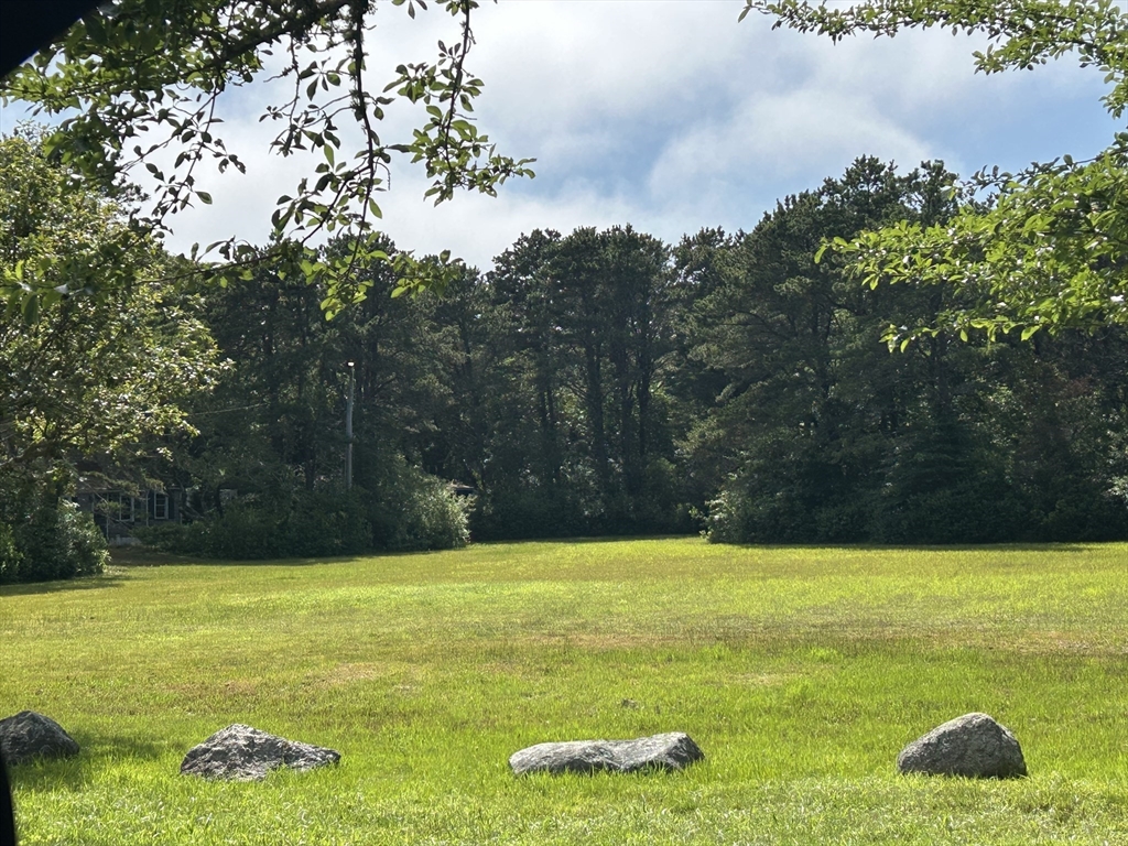 262 Old Wharf Road, Unit 67 Dennis, MA 02639 - Photo 33 of 36 a view of a swimming pool with an outdoor space and seating area