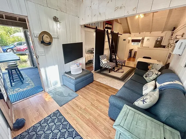 a view of living room with furniture and a window