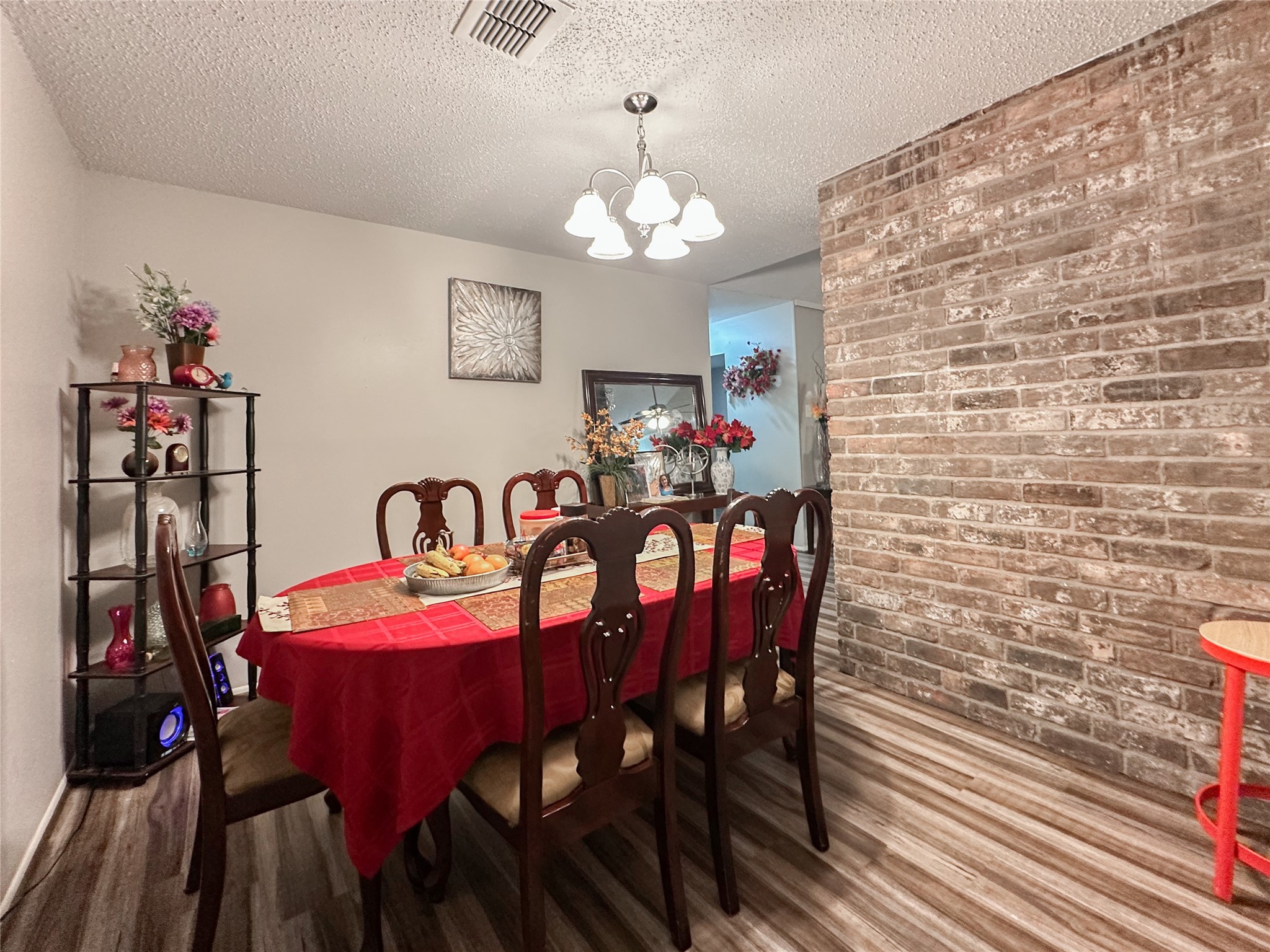 22319 Meadowgate Drive Spring, TX 77373 - Photo 11 of 19 a view of a dining room with furniture and chandelier