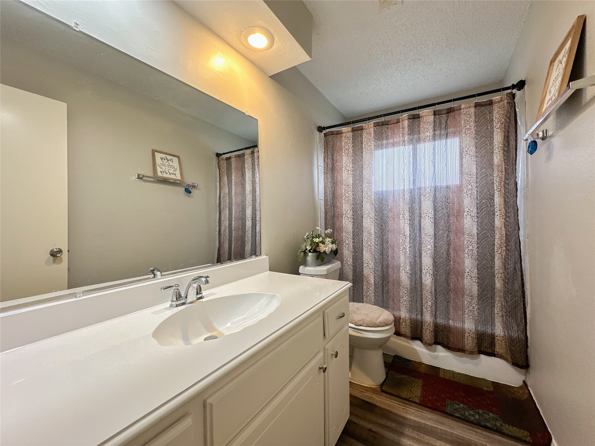 22319 Meadowgate Drive Spring, TX 77373 - Photo 15 of 19 a bathroom with a sink and a mirror