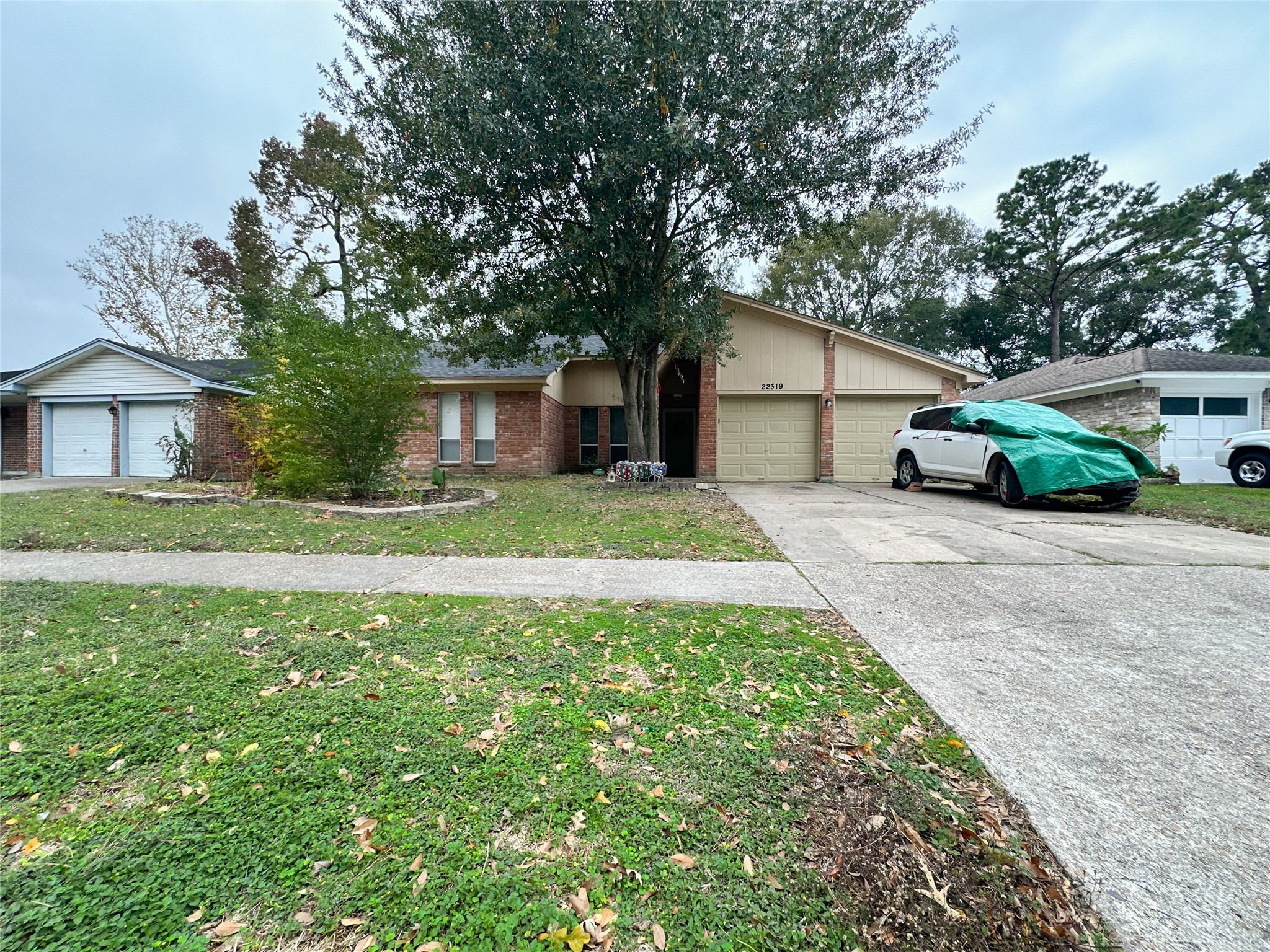 22319 Meadowgate Drive Spring, TX 77373 - Photo 18 of 19 a front view of a house with a garden and trees