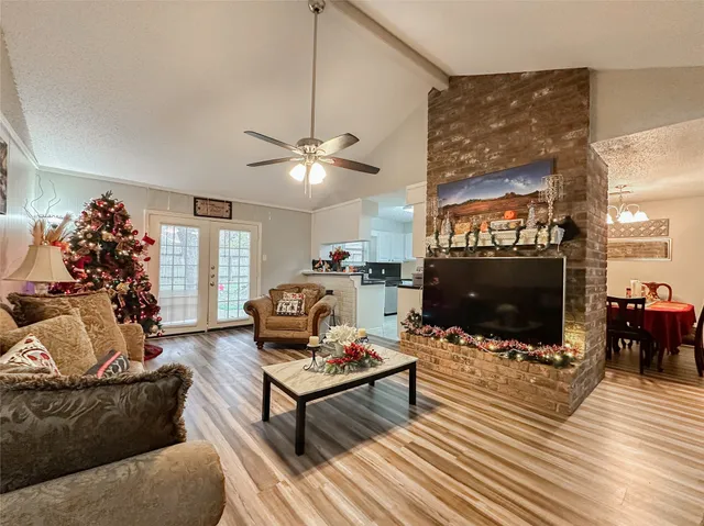 a living room with furniture and a flat screen tv
