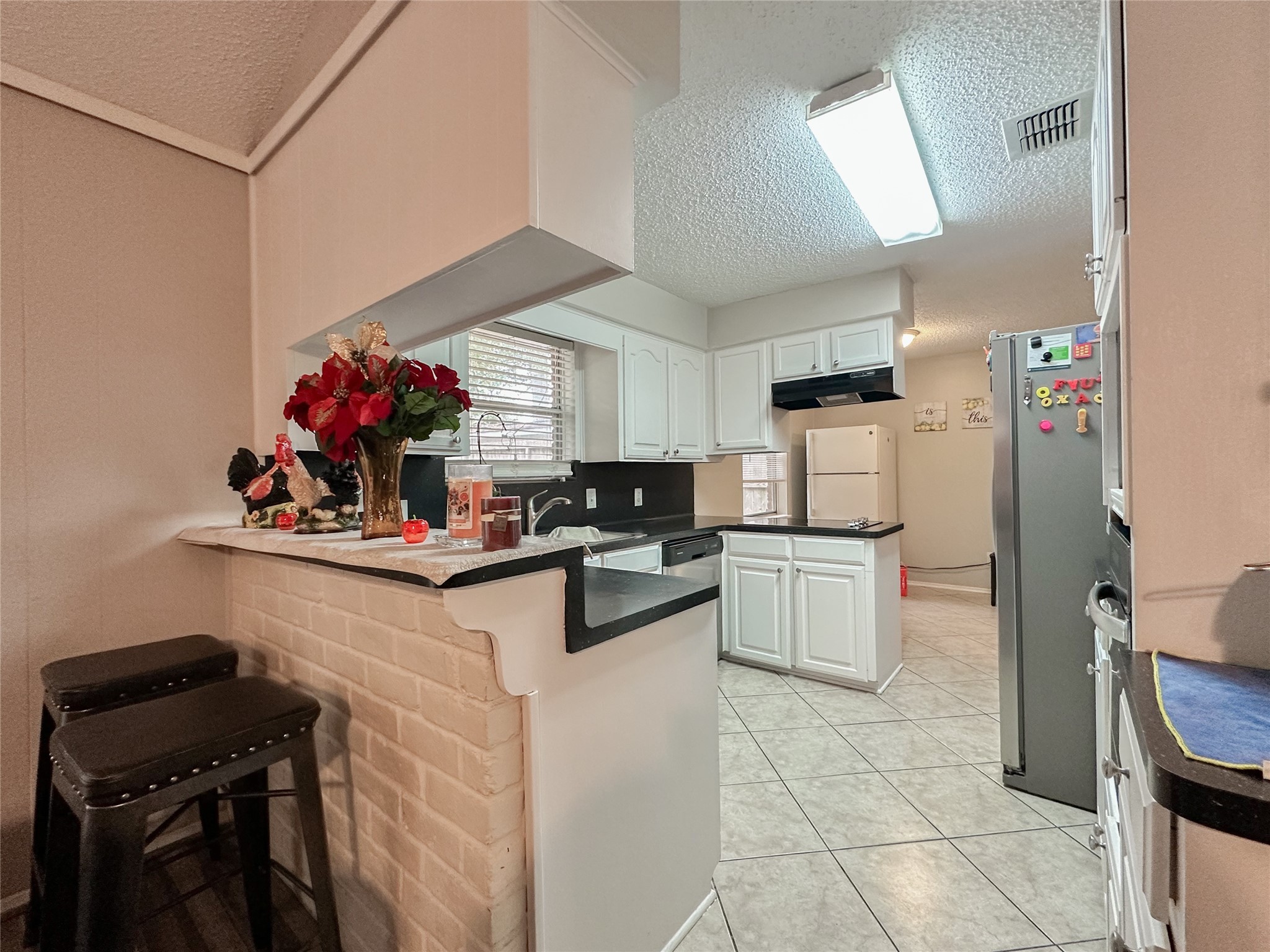 22319 Meadowgate Drive Spring, TX 77373 - Photo 6 of 19 a kitchen with a sink cabinets and window