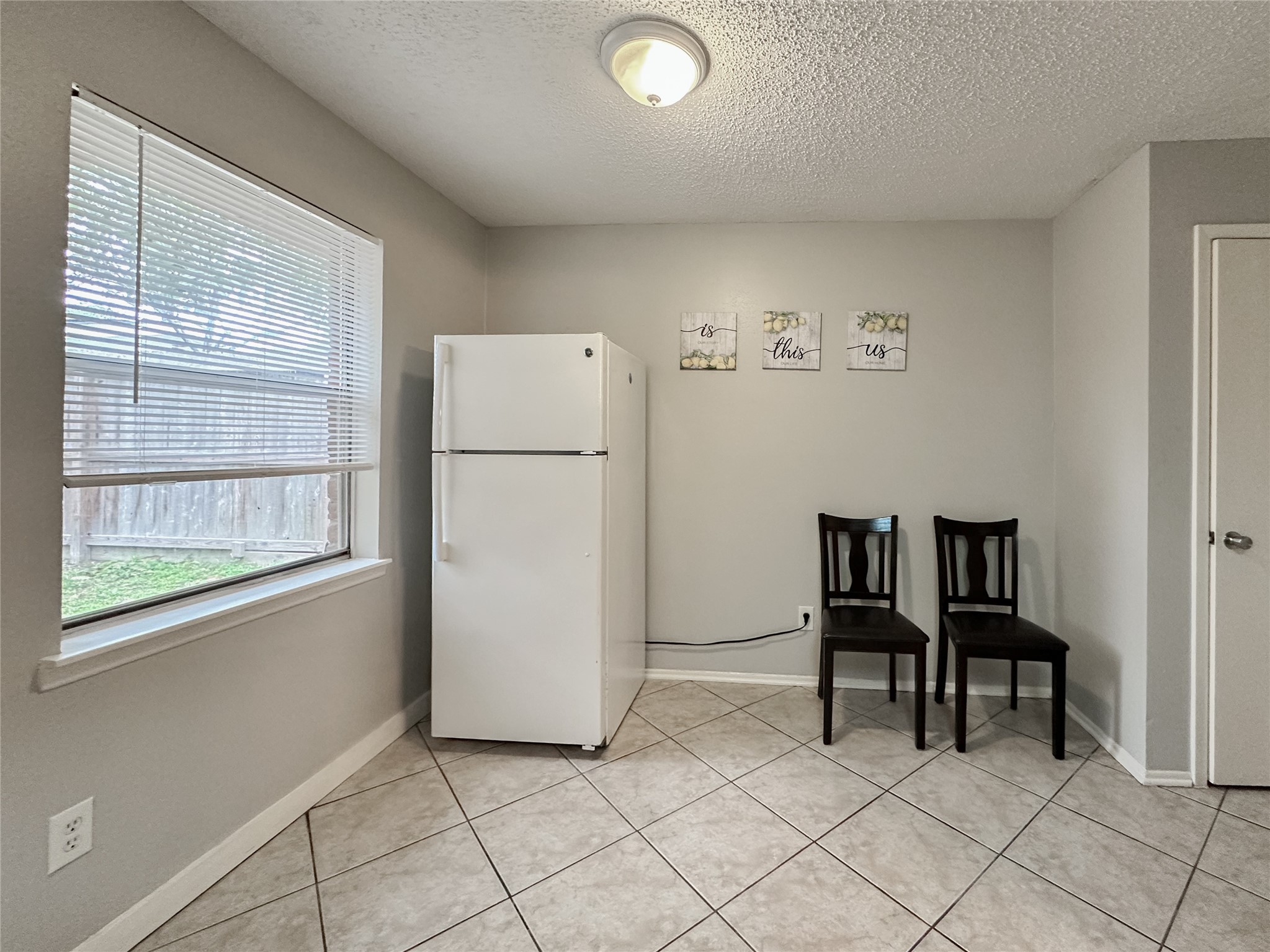 22319 Meadowgate Drive Spring, TX 77373 - Photo 10 of 19 a view of kitchen with furniture refrigerator and table