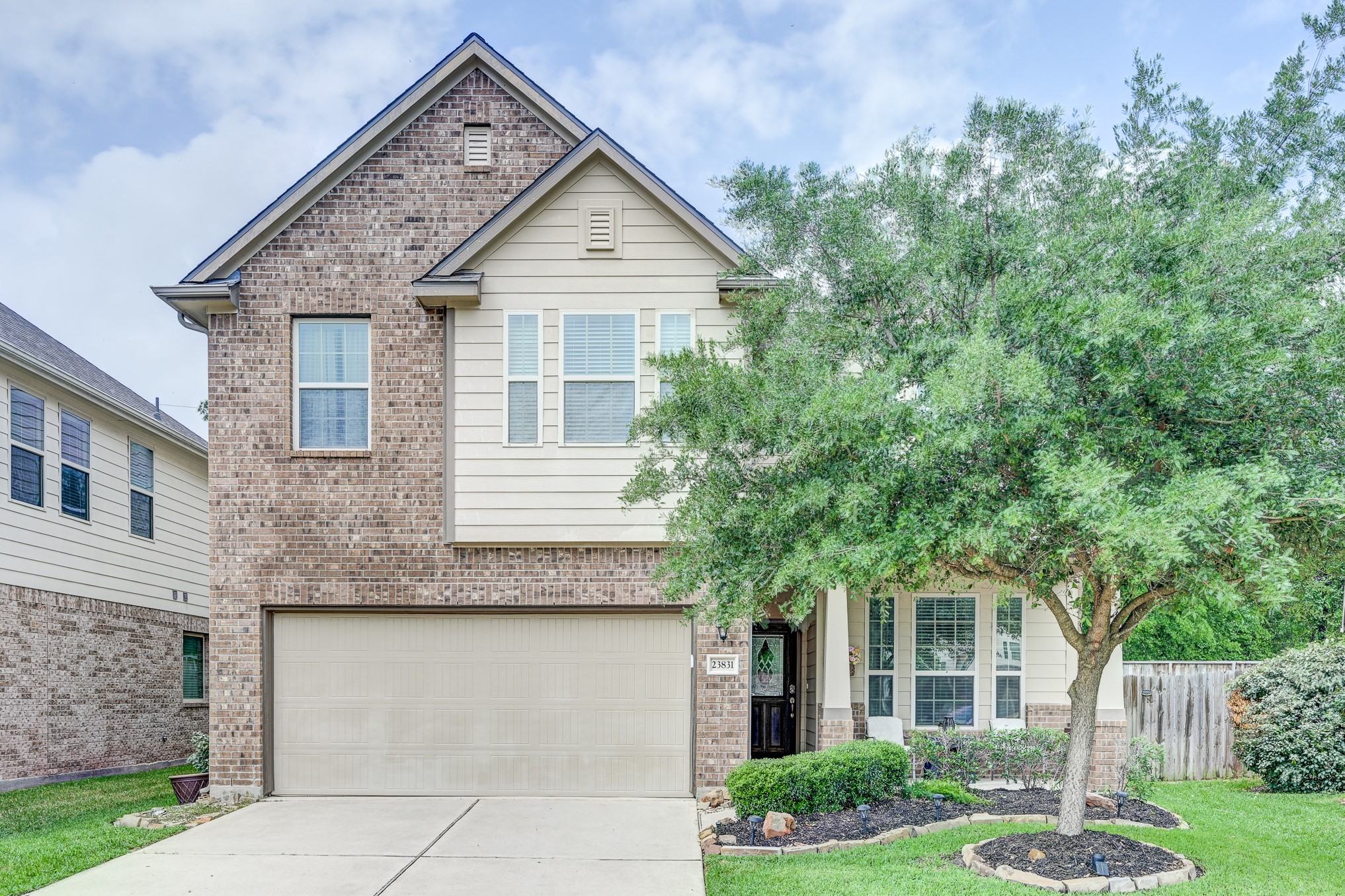 23831 Pennington Hills Drive Spring, TX 77389 - Photo 1 of 46 a front view of a house with garden
