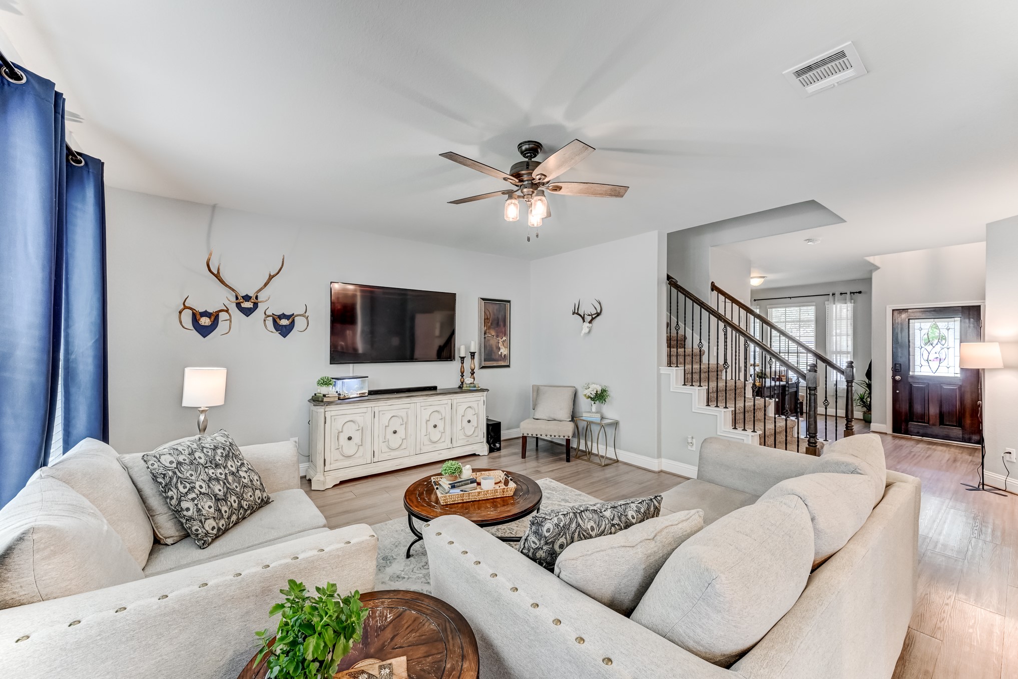 23831 Pennington Hills Drive Spring, TX 77389 - Photo 12 of 46 a living room with furniture and a flat screen tv