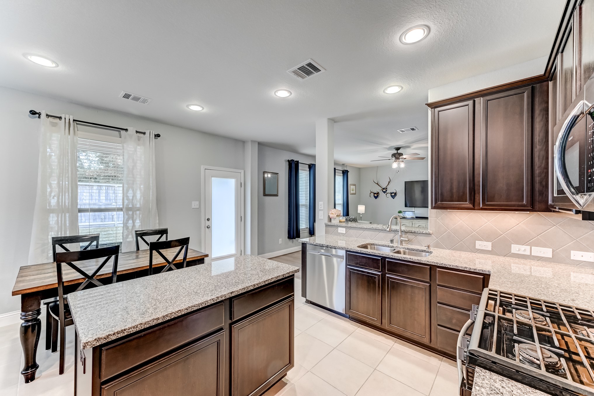 23831 Pennington Hills Drive Spring, TX 77389 - Photo 18 of 46 a kitchen with lots of counter top space and appliances