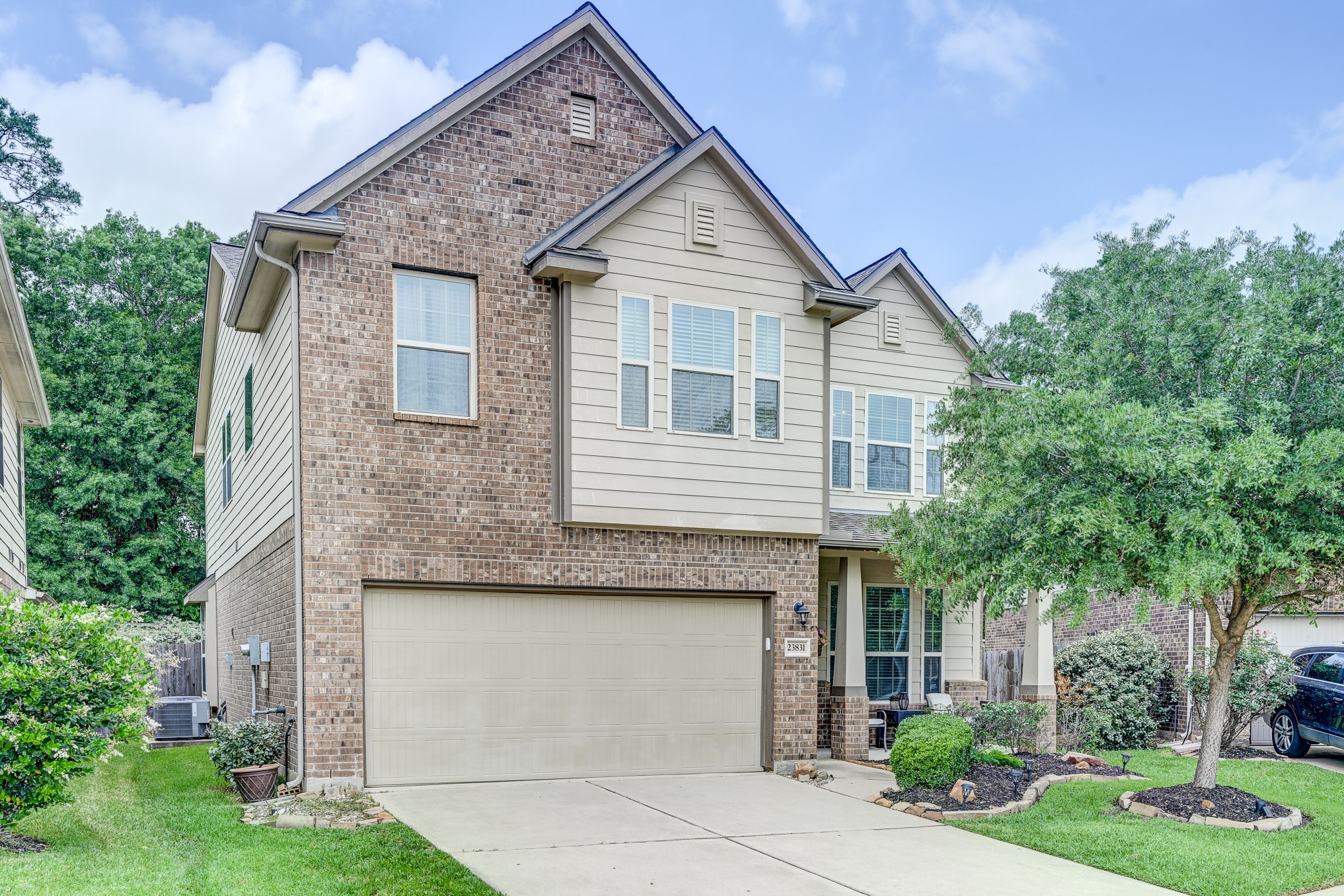 23831 Pennington Hills Drive Spring, TX 77389 - Photo 2 of 46 a front view of a house with garden