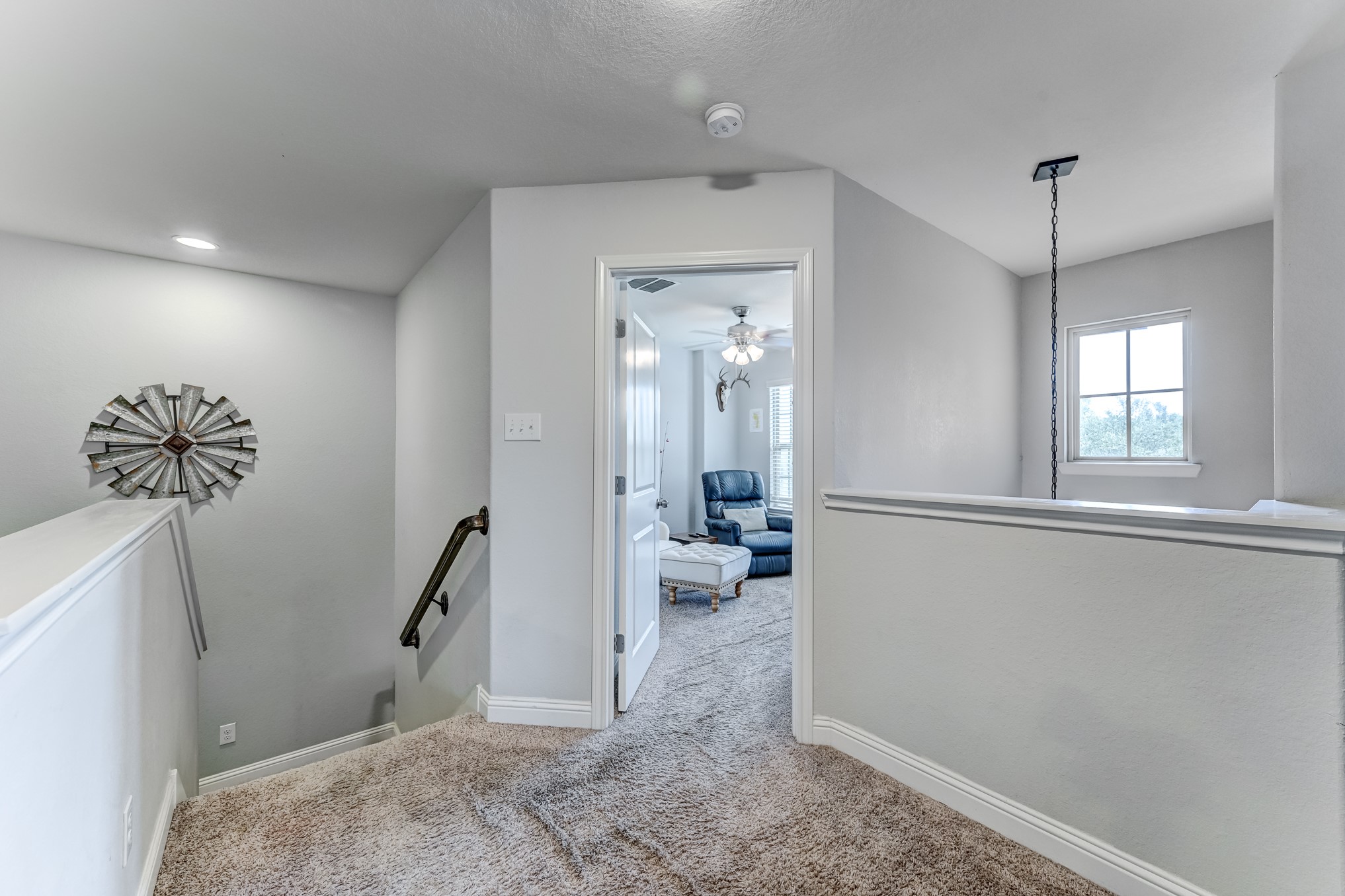 23831 Pennington Hills Drive Spring, TX 77389 - Photo 21 of 46 a view of a hallway to a livingroom with furniture and windows