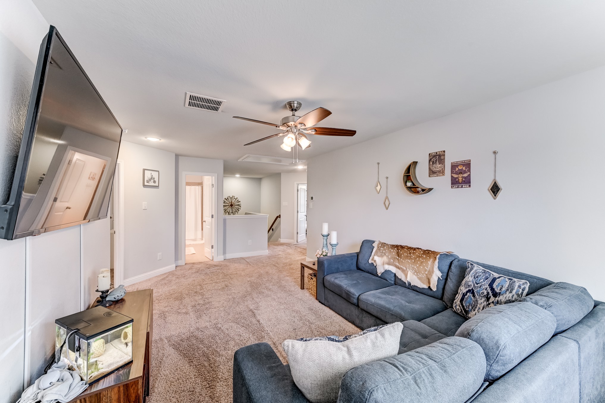 23831 Pennington Hills Drive Spring, TX 77389 - Photo 23 of 46 a living room with furniture and a flat screen tv