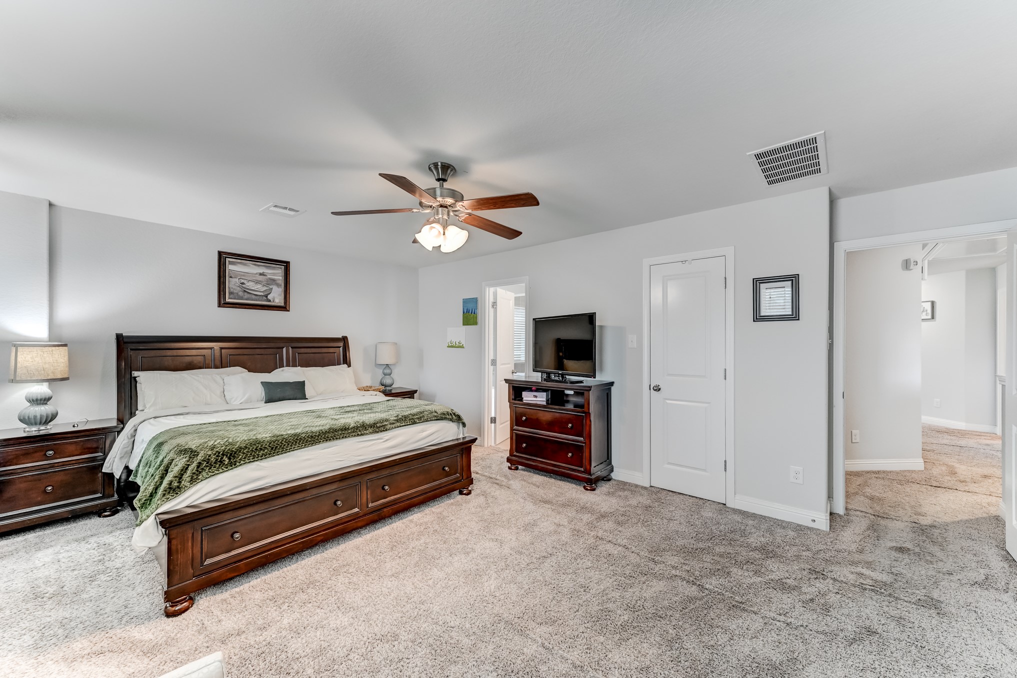 23831 Pennington Hills Drive Spring, TX 77389 - Photo 27 of 46 a bedroom with a bed and a flat screen tv