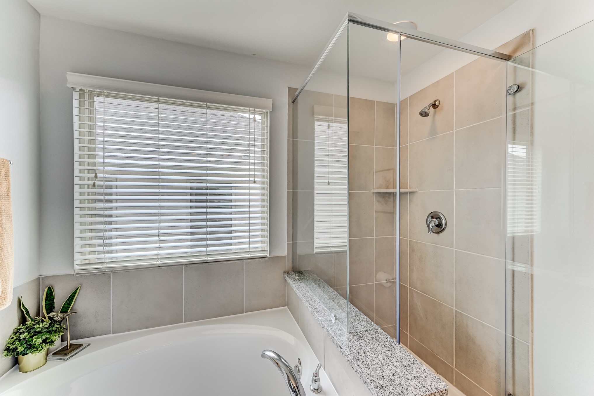 23831 Pennington Hills Drive Spring, TX 77389 - Photo 31 of 46 a bathroom with a shower and a bathtub
