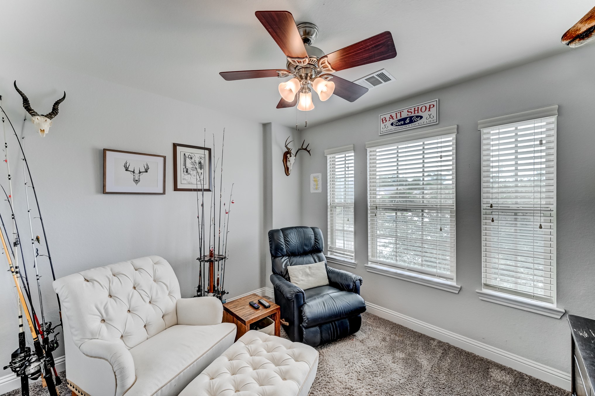 23831 Pennington Hills Drive Spring, TX 77389 - Photo 32 of 46 a living room with furniture and floor to ceiling windows