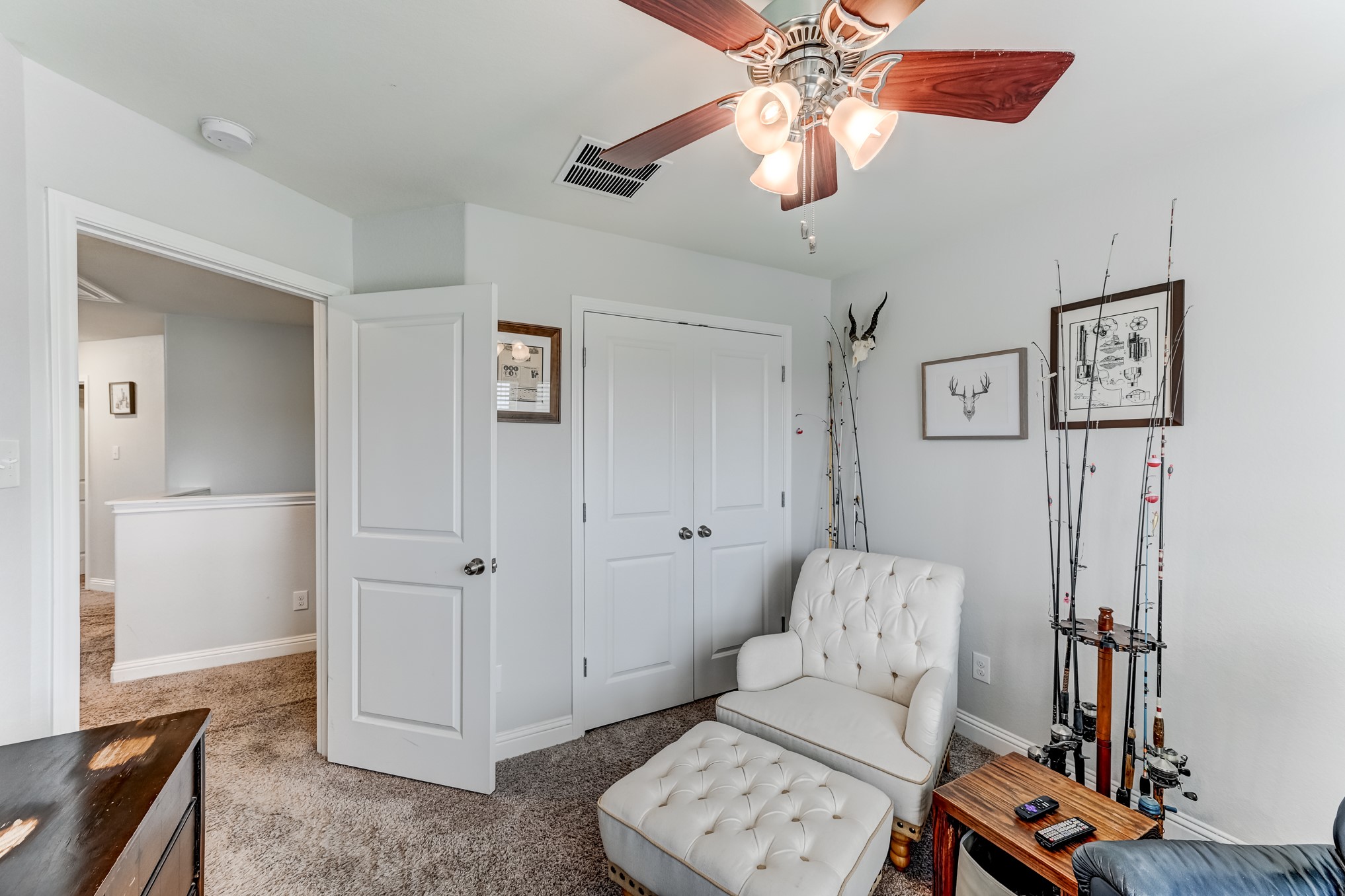 23831 Pennington Hills Drive Spring, TX 77389 - Photo 33 of 46 a living room with furniture and a flat screen tv
