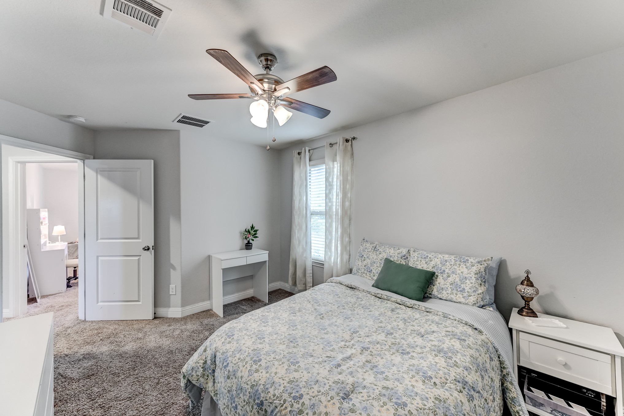 23831 Pennington Hills Drive Spring, TX 77389 - Photo 39 of 46 a bedroom with a large bed and ceiling fan