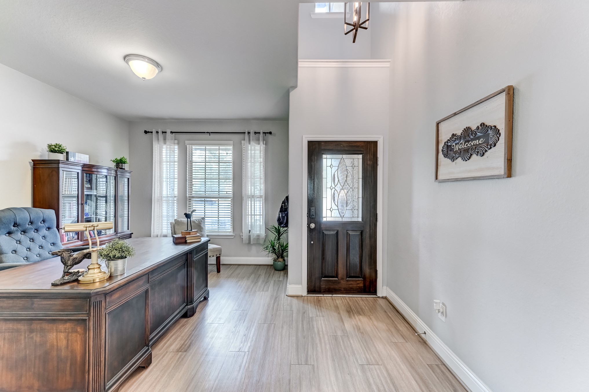 23831 Pennington Hills Drive Spring, TX 77389 - Photo 6 of 46 a large living room with stainless steel appliances wooden floor and a large window