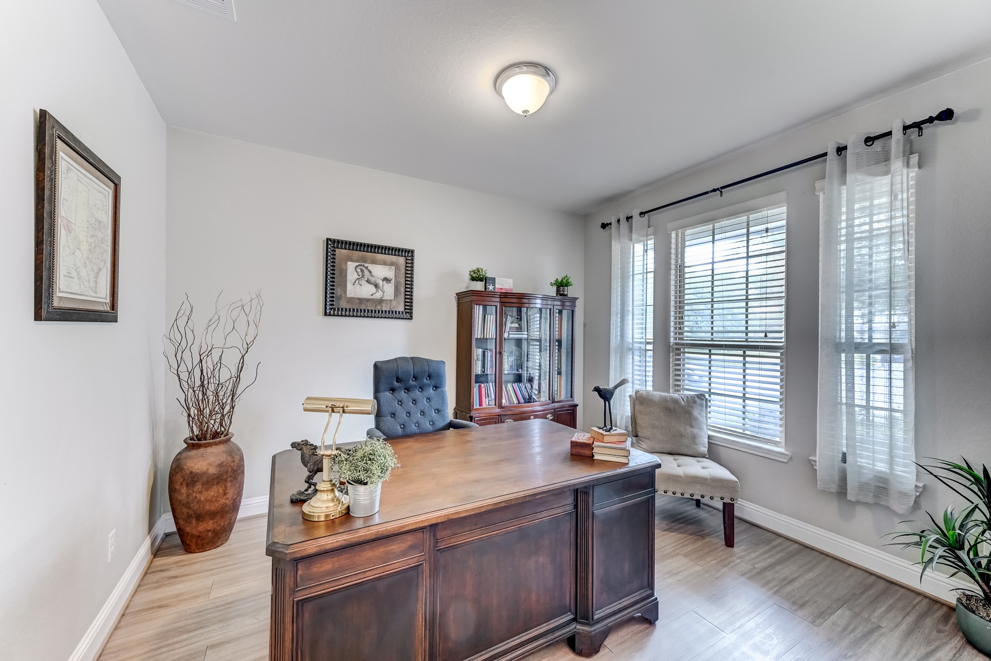 23831 Pennington Hills Drive Spring, TX 77389 - Photo 7 of 46 a living room with furniture and wooden floor