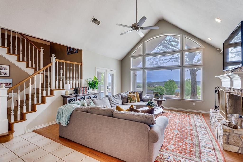 239 Hidden Creek Road Cresson, TX 76035 - Photo 11 of 36 a living room with furniture and a flat screen tv