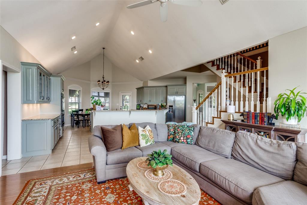 239 Hidden Creek Road Cresson, TX 76035 - Photo 12 of 36 a living room with furniture and wooden floor