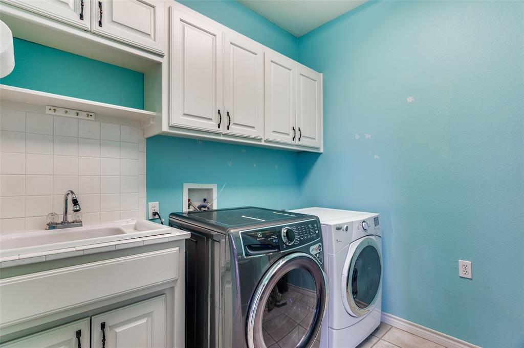 239 Hidden Creek Road Cresson, TX 76035 - Photo 19 of 36 a utility room with dryer and washer