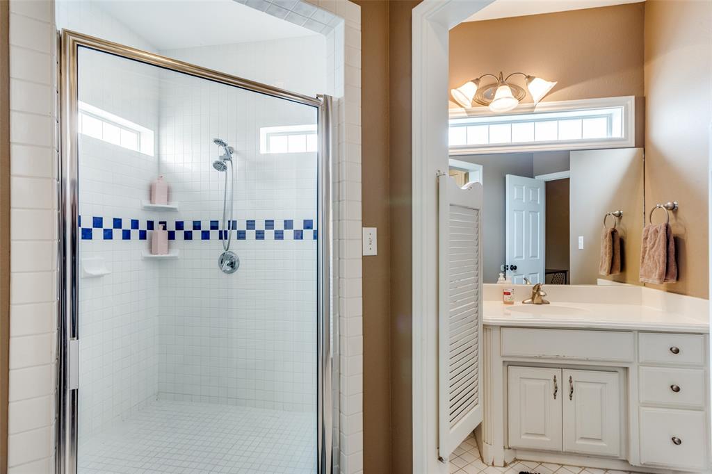 239 Hidden Creek Road Cresson, TX 76035 - Photo 22 of 36 a bathroom with a sink vanity and a mirror