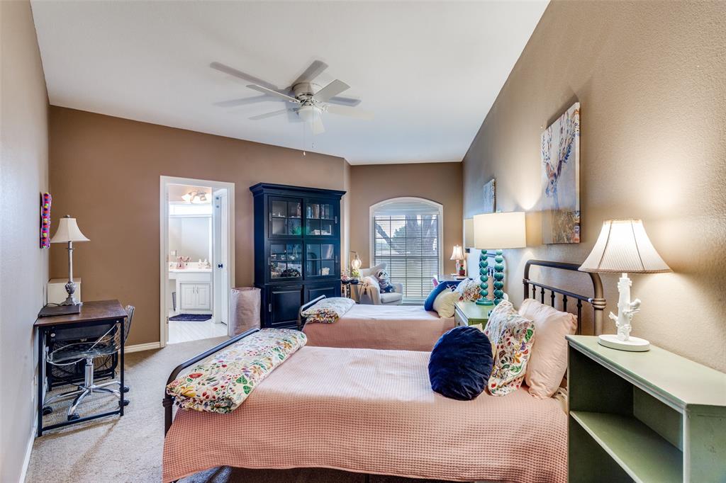 239 Hidden Creek Road Cresson, TX 76035 - Photo 23 of 36 a bedroom with a bed and window