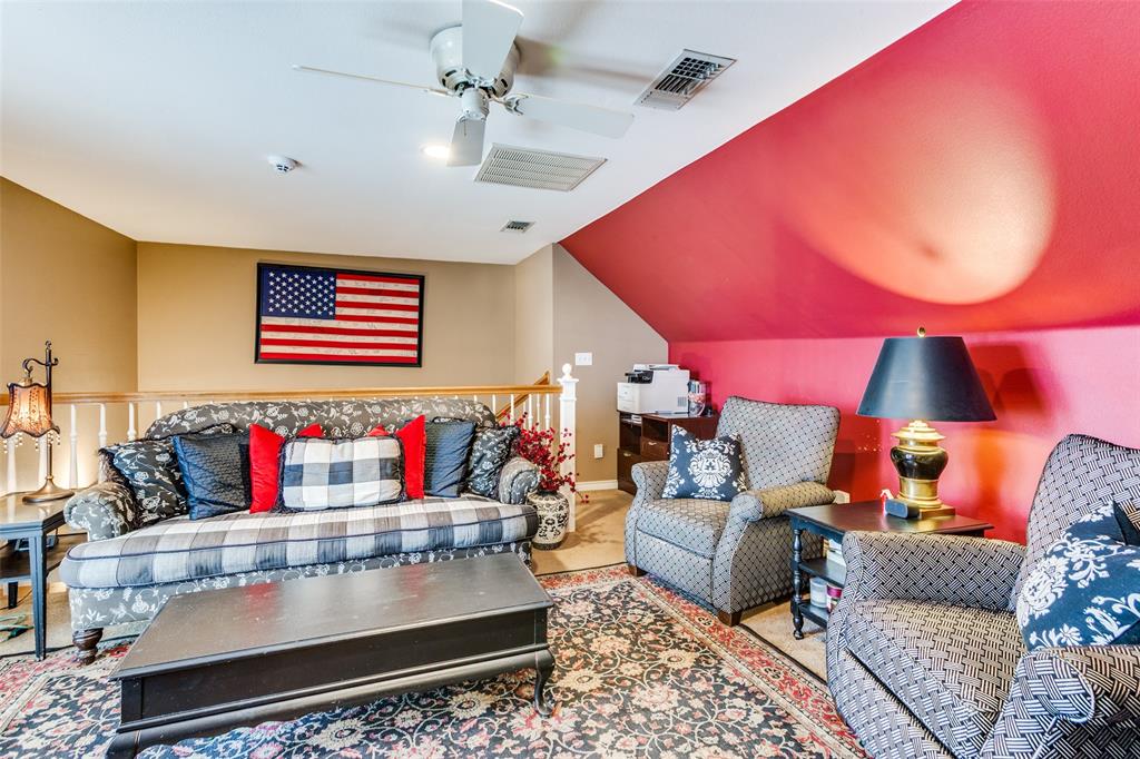 239 Hidden Creek Road Cresson, TX 76035 - Photo 24 of 36 a living room with furniture and a rug