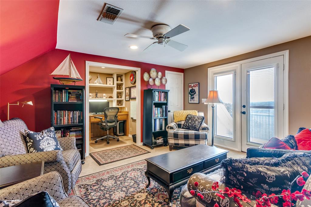 239 Hidden Creek Road Cresson, TX 76035 - Photo 25 of 36 a living room with furniture a dining table and a floor to ceiling window