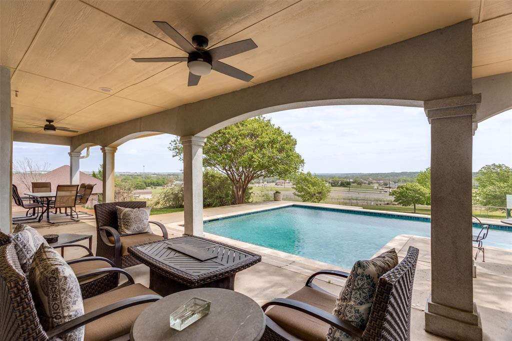 239 Hidden Creek Road Cresson, TX 76035 - Photo 28 of 36 a living room with furniture and a floor to ceiling window