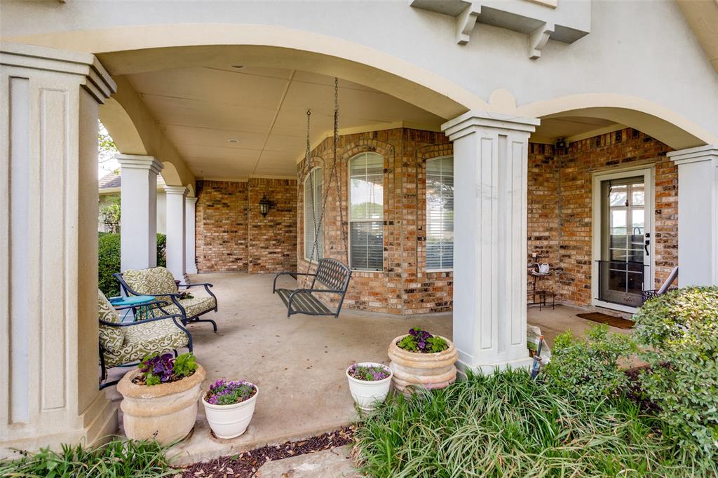 239 Hidden Creek Road Cresson, TX 76035 - Photo 3 of 36 a front view of a house with outdoor seating