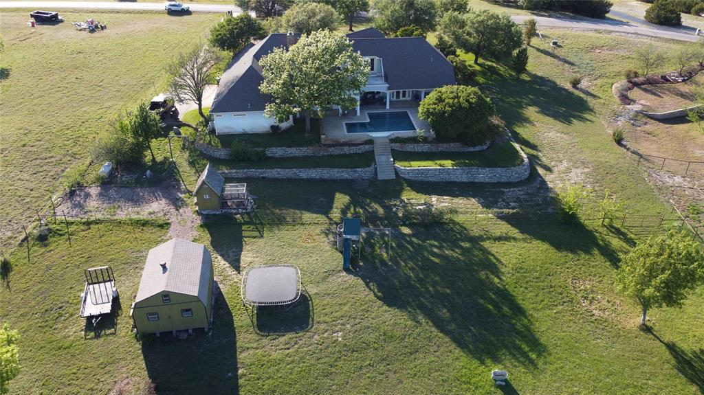 239 Hidden Creek Road Cresson, TX 76035 - Photo 34 of 36 a view of a garden with lawn chairs